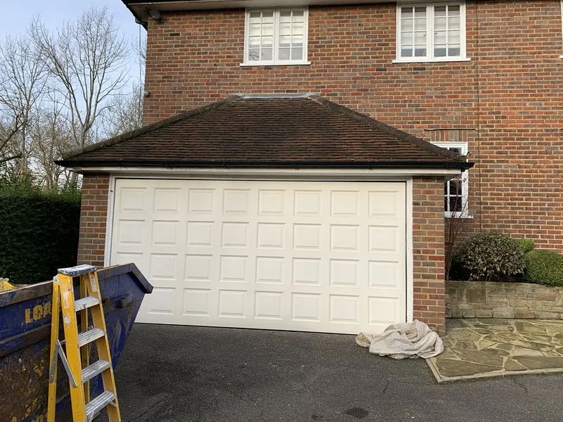 The garage door, repainted from white — before