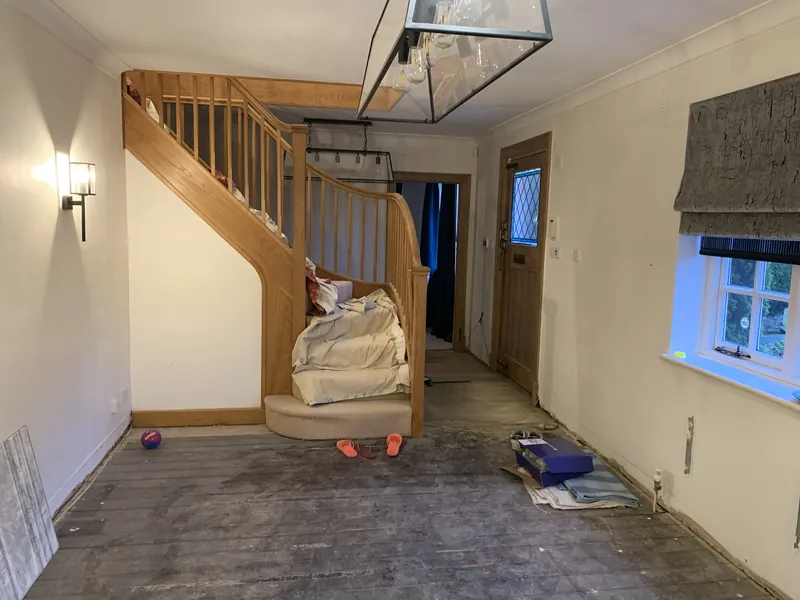 The hallway covered up before work on the staircase