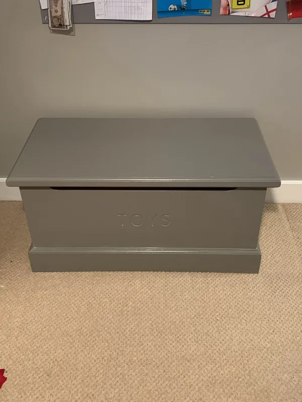 The toy box, painted to match — after