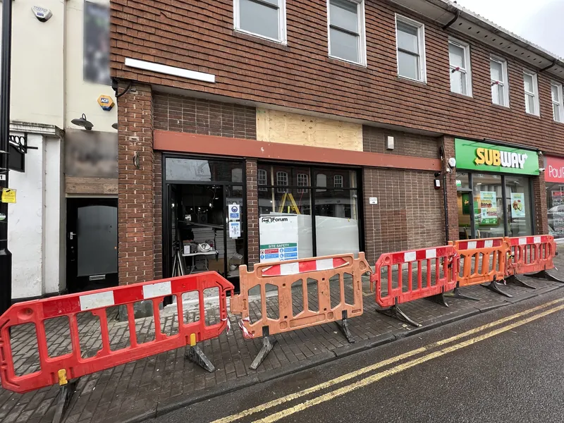 Shopfront: brickwork and frames painted for the new store — before
