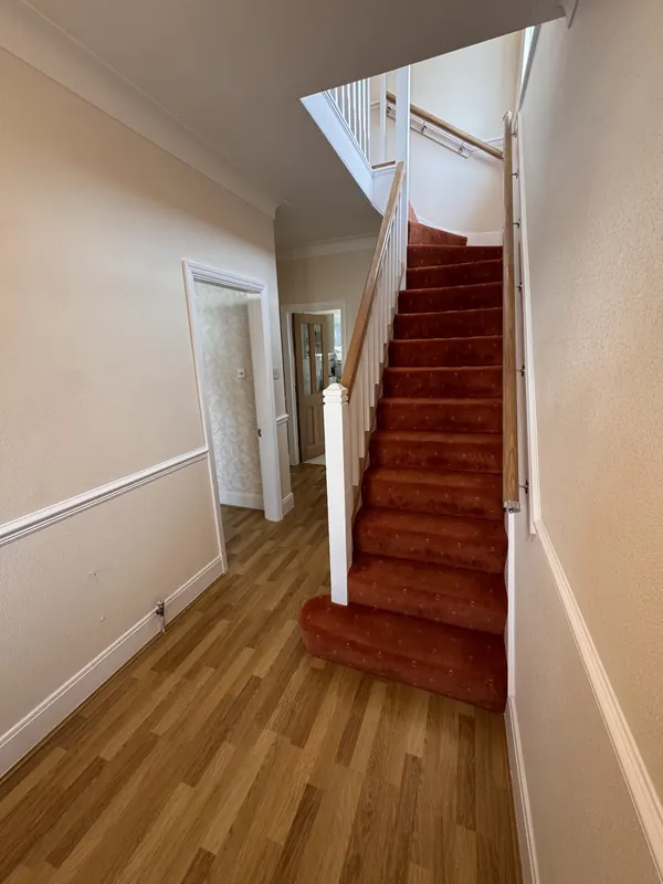 Hallway and staircase from the same spot, before and after — after