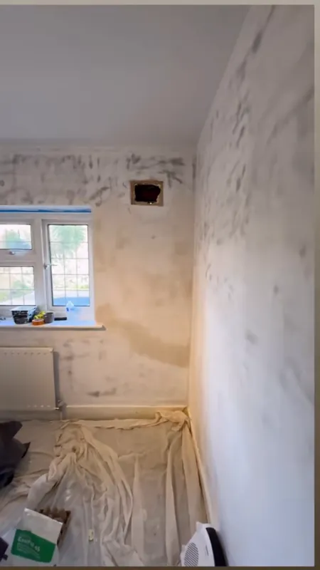 Wallpaper stripped and the wall repaired