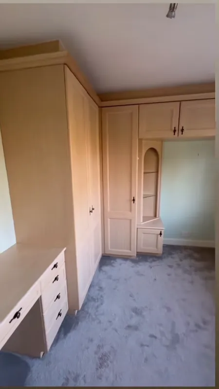 The fitted wardrobes, sanded and painted — before