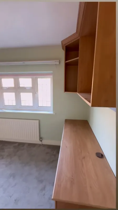 The window wall, with the old shelves and desk gone — before