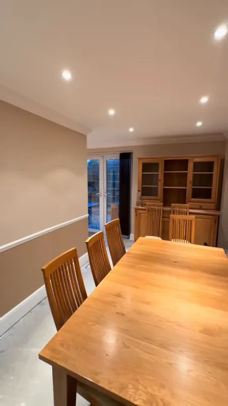 The dining area from the same spot: the wall opened up for the mould repair, then finished — after