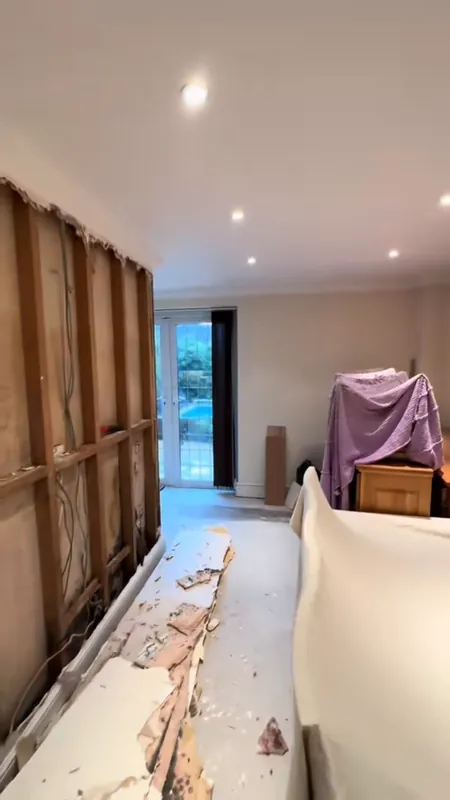 The dining area from the same spot: the wall opened up for the mould repair, then finished — during