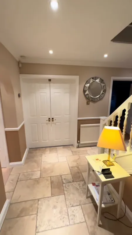 The hallway, with the ceiling, walls and woodwork painted