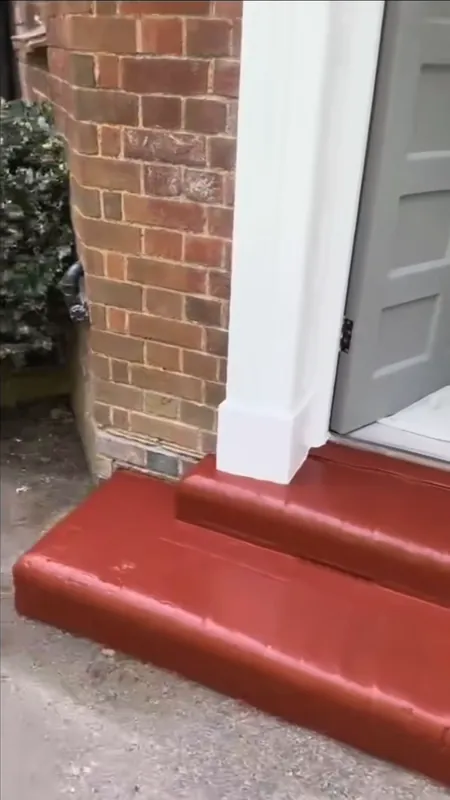 The front steps, scraped back and repainted — after