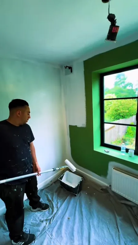 The corner by the window: the green being painted over, then the finished sugared lilac accent wall — during
