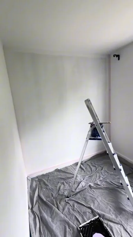 The room sheeted while the walls were painted