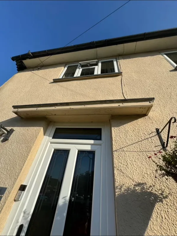 The front door canopy and walls before