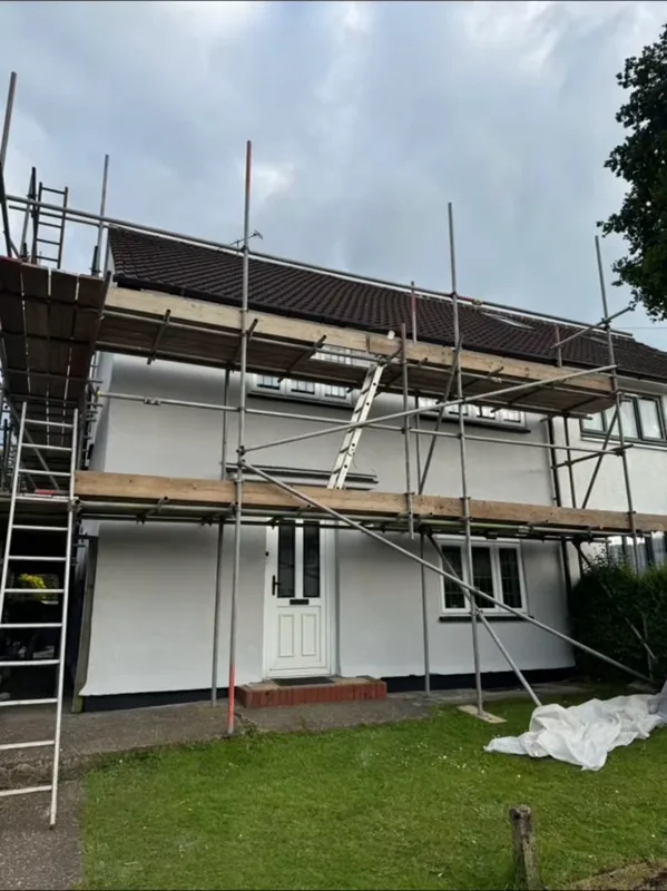 The walls painted, with the scaffold still up