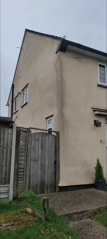 The side of the house, from the gate — before