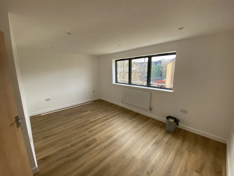 Loft bedroom with downlights and radiator