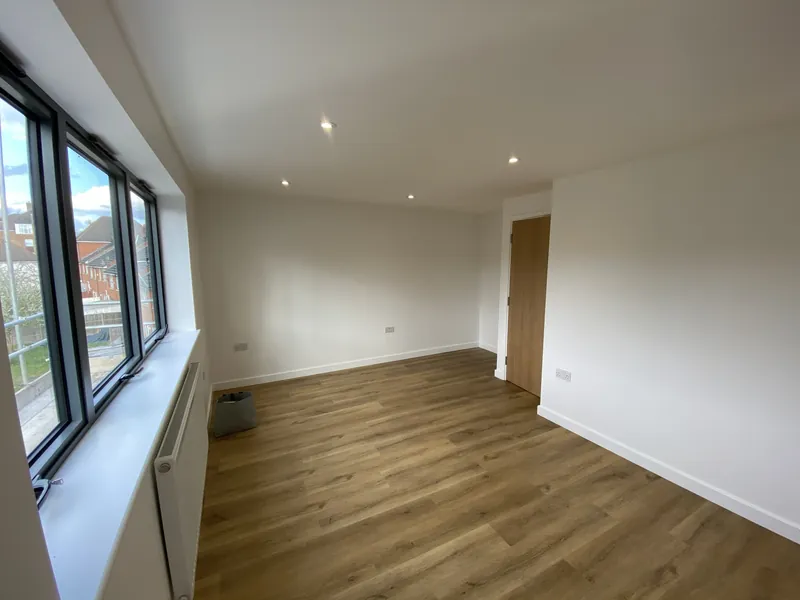 The same room from the other end: the new three-pane window we supplied and fitted — after