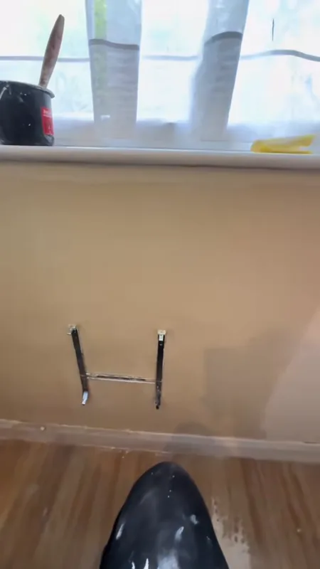Round the radiator brackets: peeling paint, then smooth and painted — after