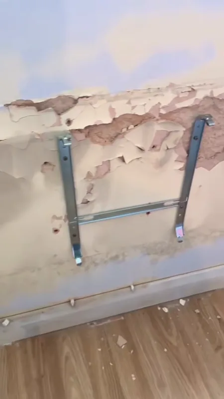 Round the radiator brackets: peeling paint, then smooth and painted — before