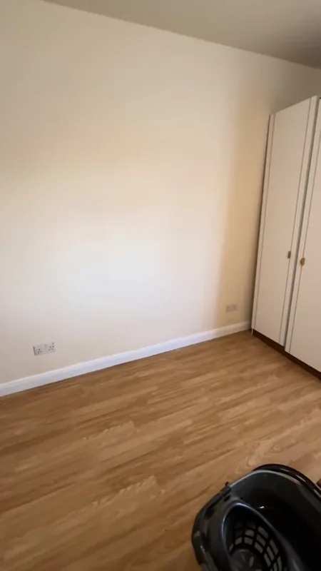 The corner by the wardrobe