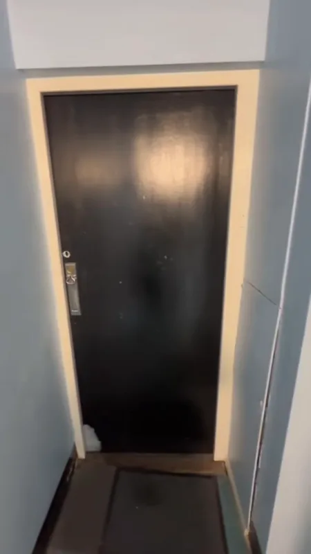 The black door, painted back to brilliant white — before