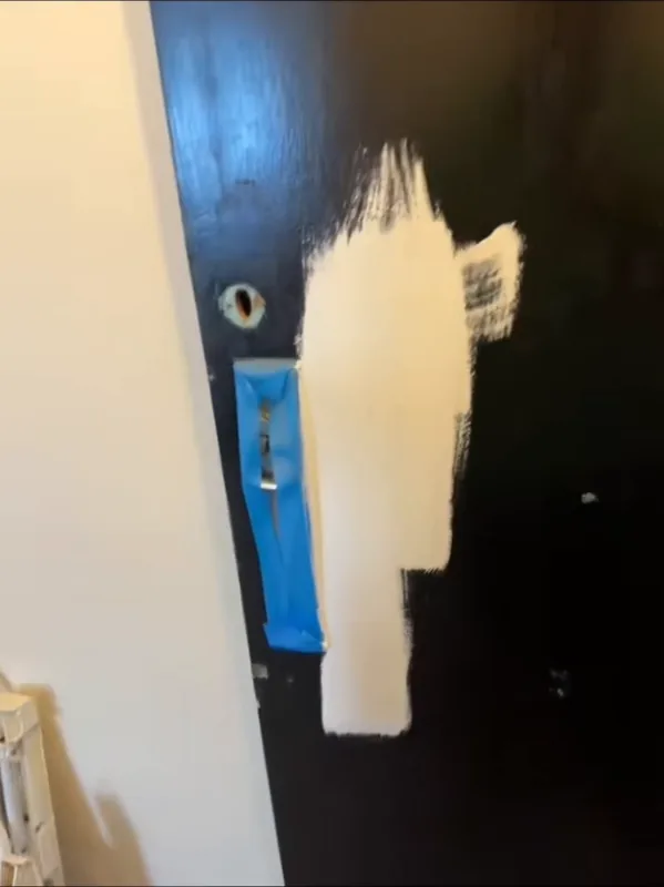 The first coat of primer going on over the black