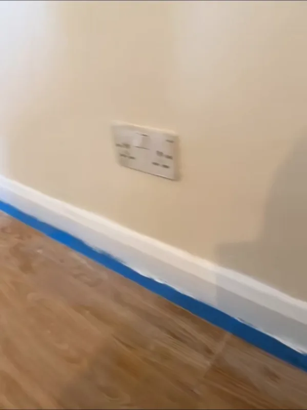 The skirting masked off while the walls were painted
