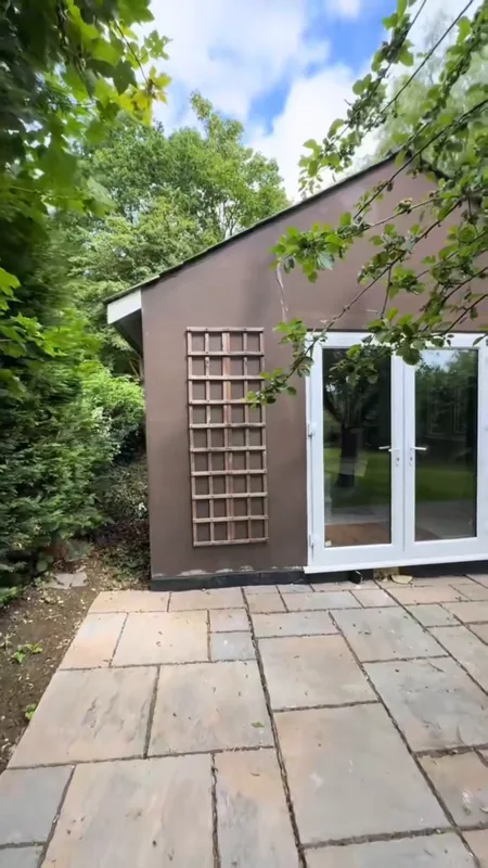The gable end with its glazed doors, from the same spot — before