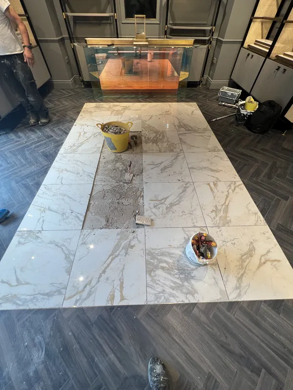 Marble-effect feature floor laid — during