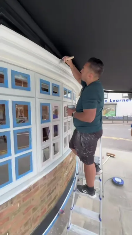 Painting the cornice above the windows