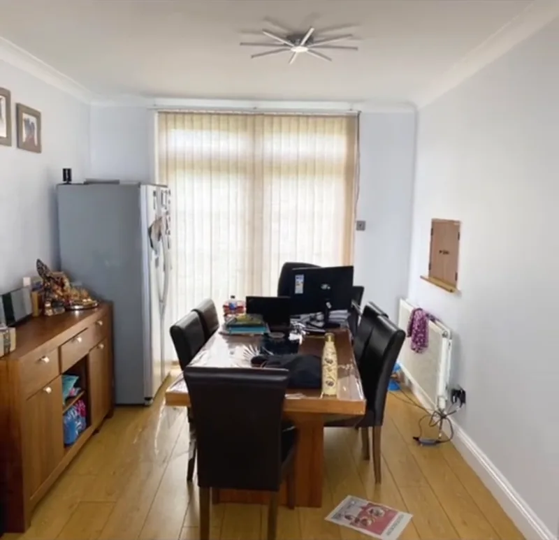 The dining room, towards the garden doors — after