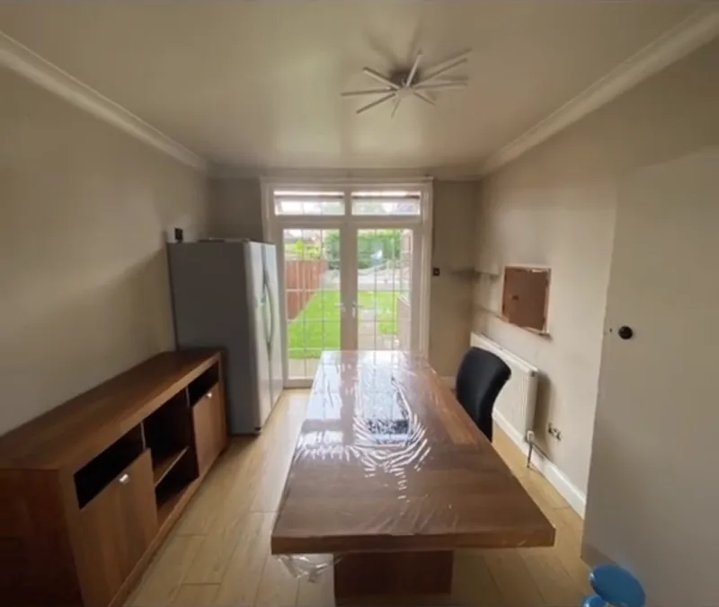 The dining room, towards the garden doors — before