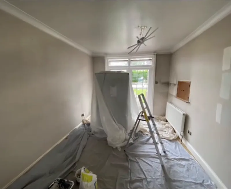 The dining room covered up, ready for painting
