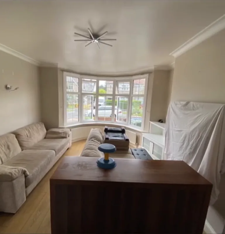 The living room and its bay window — before