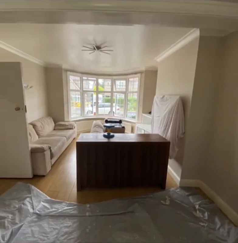 The living room protected before painting