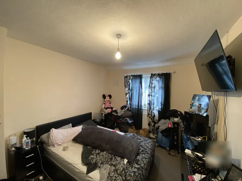 The bedroom before, towards the window