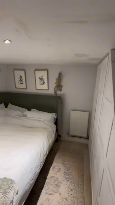The bed wall and ceiling, with the marks gone — before