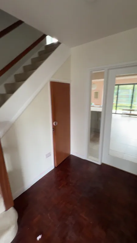 The hallway: ceiling, walls and woodwork freshly painted — after