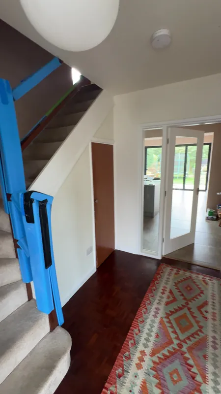 The hallway: ceiling, walls and woodwork freshly painted — before
