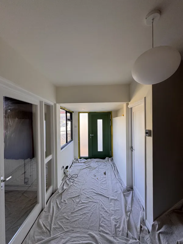 The hallway sheeted up while we painted