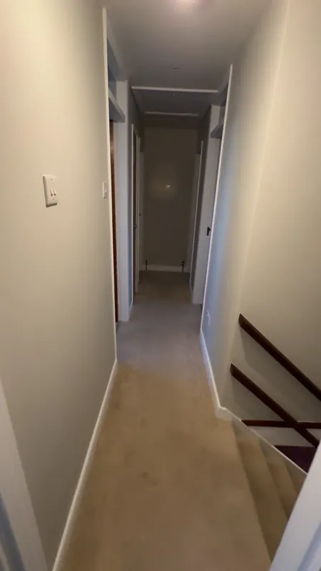 The landing: walls, ceiling and woodwork finished — after