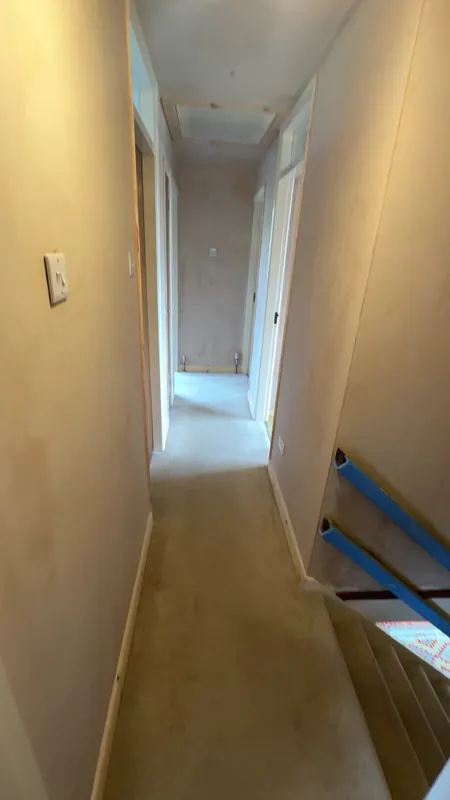 The landing: walls, ceiling and woodwork finished — before