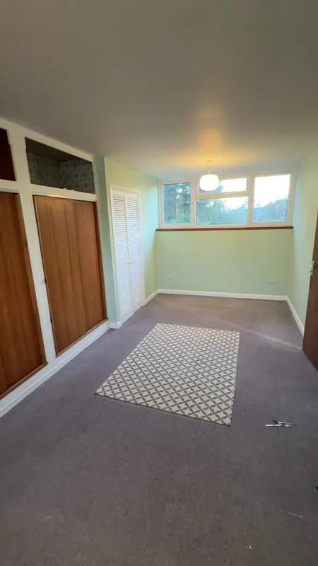 The main bedroom, wardrobe wall — after