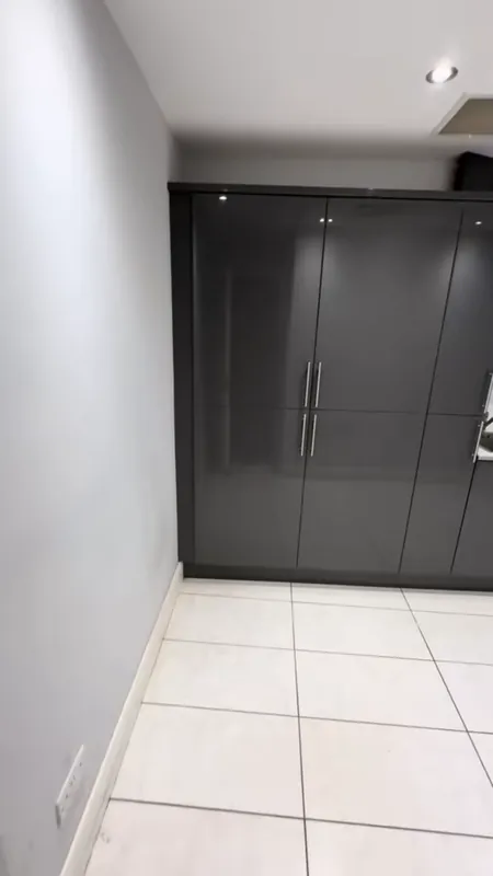 Basement: the old units stripped out, then the finished room — before